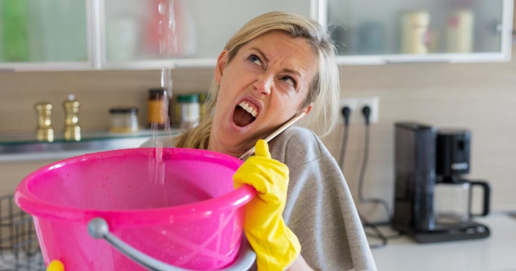 woman dealing with leak in roof