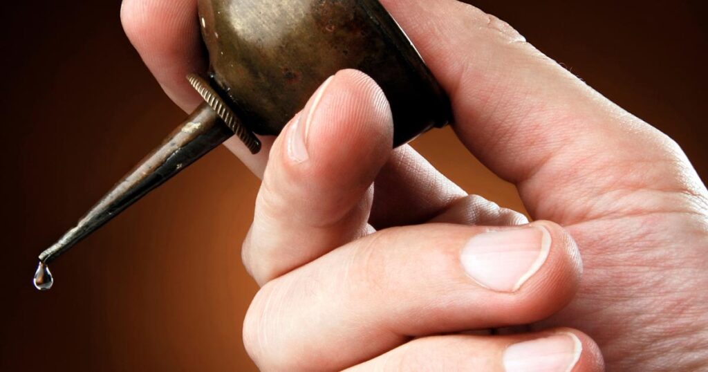 person holding lubricant