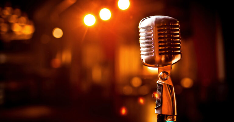 Microphone on stage. Stand up comedy concept image