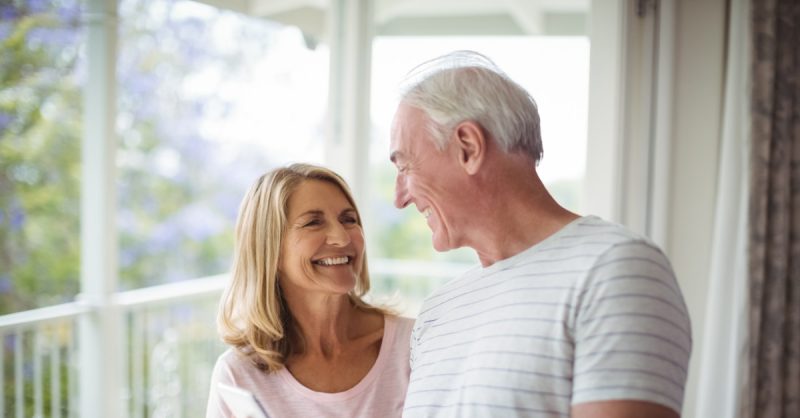Happy Senior couple outside on deck