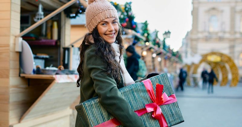 Woman holding present featured image