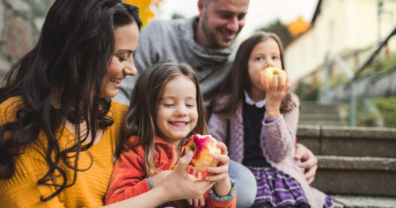 Family enjoying apples and time together in Tulsa